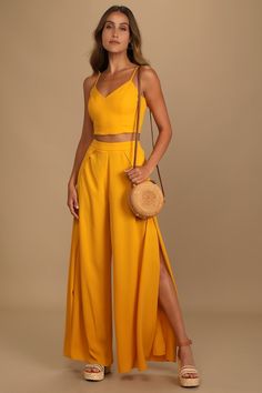 Head to the VIP in the Lulus Out Tonight Mustard Yellow Two-Piece Jumpsuit! Crepe woven fabric shapes this sleek and sexy set that includes a princess-seamed crop top with a V-neckline, and lace-up back. Matching high-waisted trousers have wide, tulip pant legs and a hidden back zipper. Fit: This garment fits true to size. Length: Floor length. Size medium Inseam: 31.50 Front Rise: 11.75 Bust: Great for any cup size. Waist: Fitted - very fitted at natural waist. Hip: Not Fitted - room for hips. Guest Ideas, Yellow Two Piece, Yellow Jumpsuit, Two Piece Jumpsuit, Summer Wedding Guests, Tequila Sunrise, Yellow Outfit, Supper Club, Guest Outfit