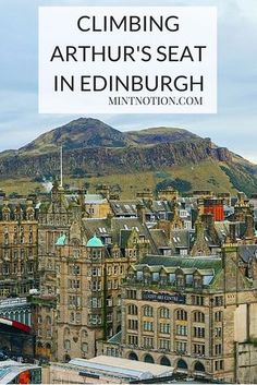 a city with tall buildings and mountains in the background