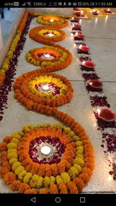 flowers and candles are laid out on the ground to be used as decorations for diwaling