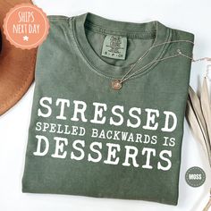 All of our clothing items are specifically created for those who have a sweet tooth! Our designs feature the playful phrase "Stressed Spelled Backwards Is Desserts", making them a charming gift for anyone who loves baking, pastry chefs, culinary students, or simply anyone with a passion for sweets. You're sure to love our dessert-themed t-shirts that are handmade to order on an ultra-soft shirt that will quickly become your go-to apparel item! Our trendy dessert-themed tees are made with eco-fri Funny Cotton T-shirt With Lettering, Casual Soft-washed T-shirt Gift, Soft-washed Crew Neck T-shirt As Gift, Baker Gifts, Baking Humor, Chef Clothes, Baking Pastry, Chef Gifts, Dessert Lover