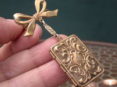 "WE SELL THIS NICE PHOTO LOCKET Pendant with pin brooch , MADE IN gold tone maybe filled decorated with little genuine diamond , in very good condition PLEASE SEE PICTURES , ORIGINAL PIECE IN IT'S ORIGINAL CONDITION AS PICTURED, the measures are 2 1/4\" x 1\" locket 1 1/8\" x 7/8\"/weight 10.4gr As is a vintage antique item , it's unique , for that if you like to wear it , don't miss the opportunity, we gladly offer MICRO-PAYMENTS upon request, email me with your payment plan. OUR POLICY: -YOU C Antique Gold Victorian Brooch Jewelry, Victorian Gold Brooch With Locket, Victorian Gold Locket Brooches, Victorian Antique Gold Brooch Jewelry, Gold Locket-shaped Brooch, Gold Pendant Locket Brooch, Gold Pendant Locket Brooches, Gold Locket Pendant Brooches, Elegant Brass Brooch For Gift