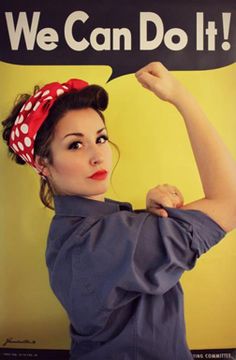 a woman with a red bandana on her head is holding up a sign that says we can do it