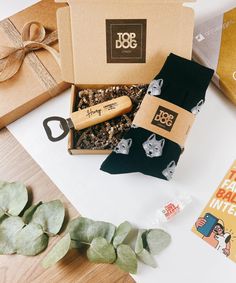 an assortment of items from the top dog gift box including socks, wine bottle openers and more