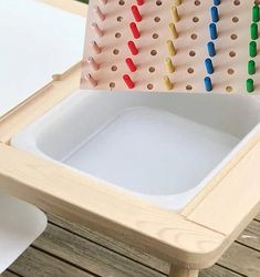 an image of a game board with colored pegs on the back and white table