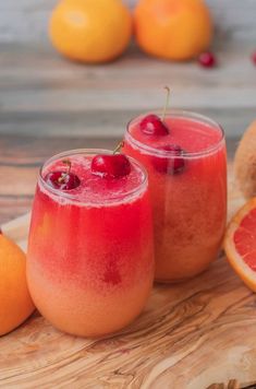 two glasses filled with watermelon and orange juice