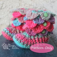 there is a crocheted hat with buttons on it