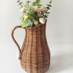 a wicker vase with flowers in it