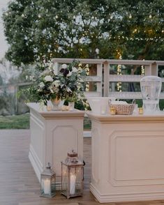 an outdoor ceremony setup with candles and flowers