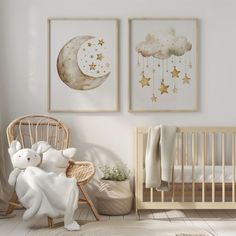 a baby's room with two posters and a crib