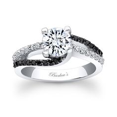 an engagement ring with black and white diamonds