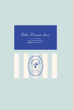 a blue and white business card with an image of a bee on the bottom corner