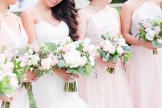 the bride and her bridesmaids are holding their bouquets in front of each other