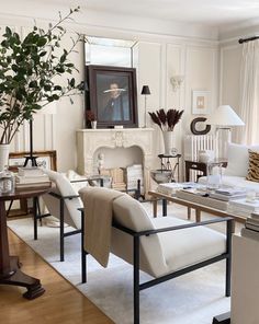 a living room filled with furniture and a fire place