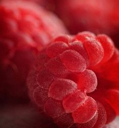 some red raspberries sitting on top of each other