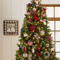 a decorated christmas tree in a living room