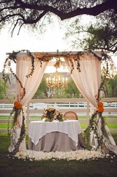 an outdoor table set up for a wedding