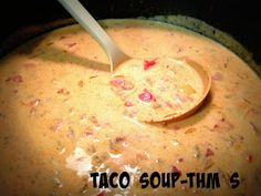 a spoon in a pot filled with soup and the words taco soup - thin's