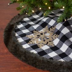 a christmas tree skirt with a snowflake on it