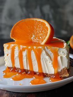 a slice of orange cheesecake on a plate with caramel drizzles