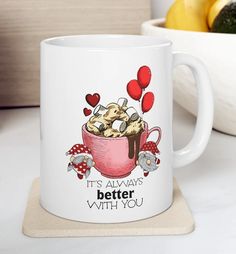 a coffee mug that has some cookies in it