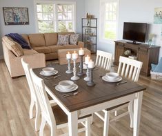 a living room and dining area with wood flooring