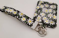 "Cute and Fun Print Handmade ID wallet key chain. This item is perfect anytime you want to go out with just the bare necessities! Wallet Details: *Zipper opening, *ID/Credit card slot button snap pocket(Exterior) *1 Key ring *Wallet Estimated Size is 5\"W x 3.5\"L *5.5x.5 Wristlet (optional) *18x.5\" Lanyard(optional) * 5.5x1\" Wristlet Strap (optional) (key fob) *Random color zipper will be used *Holds cash, change, ear buds, up to 12 credit cards, library cards, student ID etc. *4x3\" Card Hol Black Rectangular Wristlet For Gift, Rectangular Black Wristlet For Gift, Rectangular Black Wristlet As A Gift, Black Wristlet With Card Slots For Gift, Black Badge Holders With Id Window As Gift, Black Rectangular Badge Holders For Gifts, Rectangular Black Badge Holders As Gift, Black Rectangular Badge Holder For Daily Use, Black Rectangular Badge Holders For Daily Use