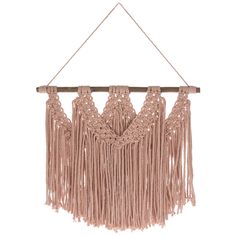 a pink macrame hanging on a wall