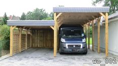 a van is parked in front of a carport with a roof over the garage