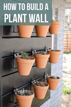 an outdoor wall mounted planter with plants in it and the words how to build a plant wall above it