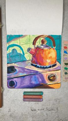 a painting of a tea kettle on a stove with crayons next to it