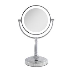 a round mirror sitting on top of a metal stand