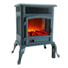 an electric stove with the door open and fire in it