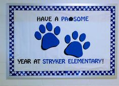 a blue and white sign that says have a pawsome year at strick elementary