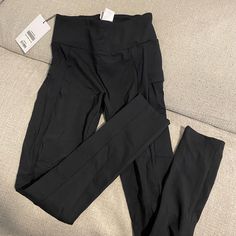 Size Small Color: Black Condition: 10/10 Pet/Smoke Free Home Brand New Functional High Waist Black Bottoms, High Stretch Black Bottoms With Side Pockets, Functional High Rise Black Bottoms, Black Fitted Activewear With Side Pockets, Black High Stretch Bottoms With Side Pockets, Black High-stretch Bottoms With Side Pockets, Stretch Black Leggings With Side Pockets, Black Stretch Leggings With Side Pockets, High Stretch Black Pants With Side Pockets