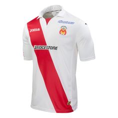 a white and red soccer jersey with an emblem on the chest, in front of a white background