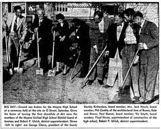 an old black and white photo of men in suits with crutches standing together