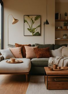 a living room with a couch, coffee table and large window looking out onto the outdoors