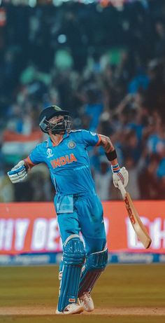 a man in blue uniform playing a game of cricket