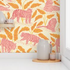 two vases are sitting on a shelf in front of a wallpapered background