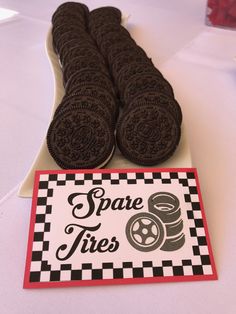 there are some cookies on the table with a sign that says spare tires next to them