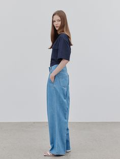 Editor's Notes The denim pants have a wide fit and a relaxed silhouette. - Two tones of blue to match various items- Thickness and density that fits the summer- Comfortable and loose fitMeasurements(in.)32 / 34 / 36- Waist: 12.99 in. / 13.78 . in. / 14.76 in. - Hips: 18.9 in. / 19.69 in. / 20.67 in. - Front Rise: 12.4 in. / 12.8 in. / 13.19 in. - Bottom Rise: 16.34 in. / 16.73 in. / 17.13 in. - Bottom Hem: 10.43 in. / 10.63 in. / 11.02 in. - Total Length: 40.55 in. / 40.94 in. / 41.54 Summer Denim Blue Wide Leg Pants With Five Pockets, Modern Denim Blue Wide-leg Pants, Modern Wide-leg Denim Blue Pants, Modern Wide Leg Blue Bottoms, Modern Wide-leg Jeans For Summer, Modern Wide-leg Summer Jeans, Modern Blue Jeans For Summer, Modern Straight Jeans For Summer, Denim Pants