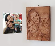 a family portrait carved into wood next to a wooden plaque with an image of a man, woman and child on it