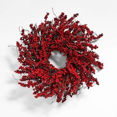 a red berry wreath on a white background