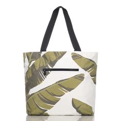 Beach day essential... This packable, splash-proof tote is an Aloha Collection bestseller. With a fun tropical leaf print, this go-anywhere bag will keep your essentials protected against splashes, spills, and weather and features an expandable zipper top to maximize space. Features: Single Outside Zipper Pocket Two Inside Zipper Pockets 19" W x 14.5" H (17.5" expanded) 1.5" wide nylon straps 11" strap drop length Easy to clean Features a white interior SPLASH-PROOF® technology for light water r Best Beach Bag, Aloha Collection, Plane Ticket, Tropical Leaf Print, Pack Your Bags, Beach Essentials, Easy Organization, Small Pouches, Maximize Space