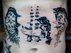 a woman's stomach with tattoos on it and two faces drawn in black ink