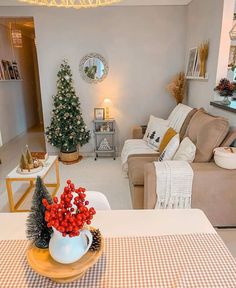 a living room filled with furniture and a christmas tree