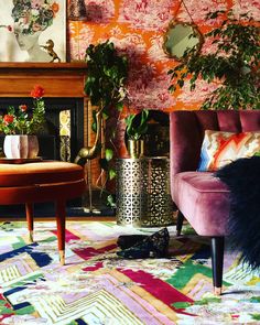 a living room filled with furniture and flowers