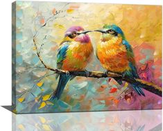 two colorful birds are sitting on a branch