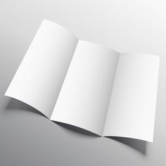 an open white book on a gray background