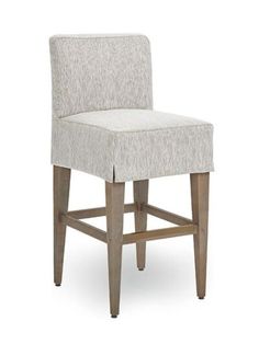 an upholstered bar stool with wooden legs and fabric seat padding, on a white background